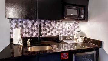 Microwave, coffee/tea maker, cookware/dishes/utensils, paper towels