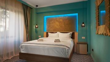 A neatly made bed with a wooden frame, a headboard with a textured panel, and a bedside table with a lamp.