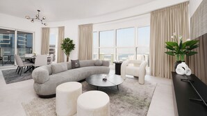 Een moderne woonkamer met een hoekbank, een rond salontafeltje en een eethoek met stoelen.
