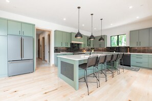 Enjoy dining and socializing at the kitchen island with bar stools.