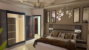 A modern bedroom with a large bed, a wardrobe, and a mirror wall. - Fancy 3 bedrooms  240 m apartment in sheik zayed compound (6th of october)