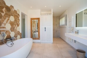 Shower, hair dryer, towels, toilet paper
