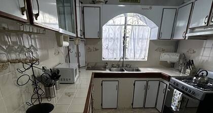 Spacious 4-bedroom residence featuring a ground floor apartment.