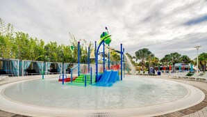 A water play area with slides and a water fountain. - Pool, Games & Disney Magic! Epic Family Oasis (Davenport)
