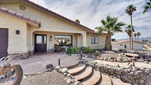 A house with a patio, stone steps, and palm trees. - Havasu Oasis w/ Pool & Spa on Quiet Cul-de-sac (Lake Havasu City)