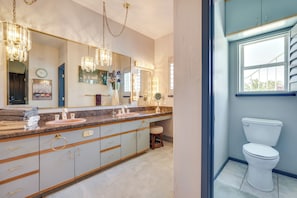 A bathroom with a vanity, a sink, a mirror, and a toilet. - Lake Havasu Home w/ Rooftop Deck ~ 1 Mi to Beach! (Lake Havasu City)