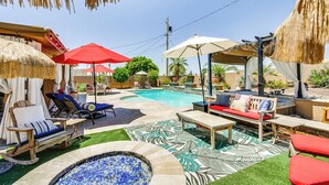 A backyard with a swimming pool, lounge chairs, a hot tub, and a fire pit. - Outdoor Oasis: Home w/ Hot Tub in Lake Havasu City (Lake Havasu City)