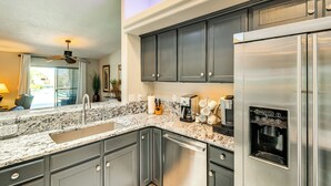 A kitchen with a stainless steel refrigerator, a coffee maker, and a water dispenser. - Outdoor Oasis: Home w/ Hot Tub in Lake Havasu City (Lake Havasu City)