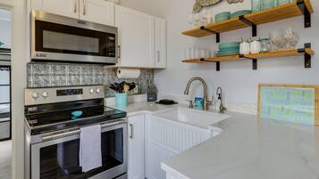 High chair, cookware/dishes/utensils, paper towels