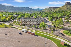 A large building with multiple floors, surrounded by a parking lot and roads. - 5 Mi to Red Rocks! Updated Home Near Hiking Trails (Golden)