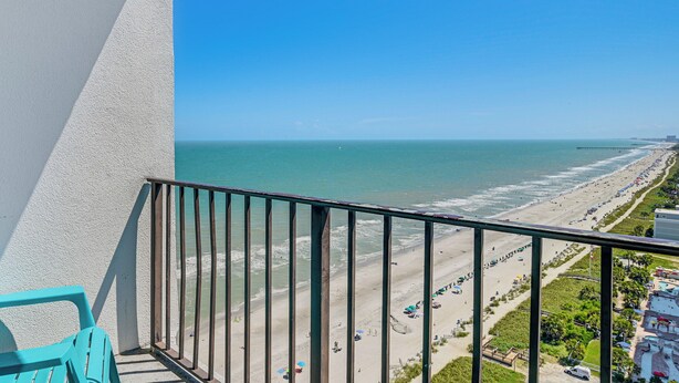 A balcony with a view of a beach and ocean. - Pool Access: Oceanfront Myrtle Beach Getaway! (Myrtle Beach)