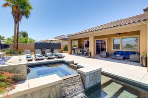 A backyard with a swimming pool, outdoor furniture, and a patio area. - Luxury Palm Desert Vacation Home w/ Private Oasis (Palm Desert)