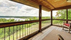 A wooden deck with a view of a lake and forest. - Eagle Rock Gem on Table Rock Lake w/ Decks & Grill (Eagle Rock)