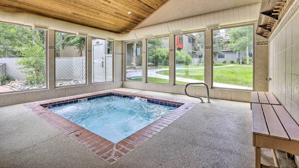 A hot tub with a wooden ceiling and large windows. - Ski Retreat: Keystone Resort Condo w/ Heated Pool! (Keystone)