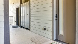 A building exterior with a door, a mailbox, and a set of lockers. - Mountain-view Fraser Condo w/ Balcony + Hot Tub! (Fraser)