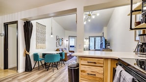 A modern kitchen with wooden cabinets, a countertop, and a trash can. - Pool + Ski-in Access: Copper Mountain Condo! (Copper Mountain)