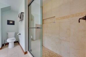 A bathroom with a glass shower door, a toilet, and a towel rack. - Mendon Home w/ Hot Tub, Fire Pit & Near Skiing! (Rutland)
