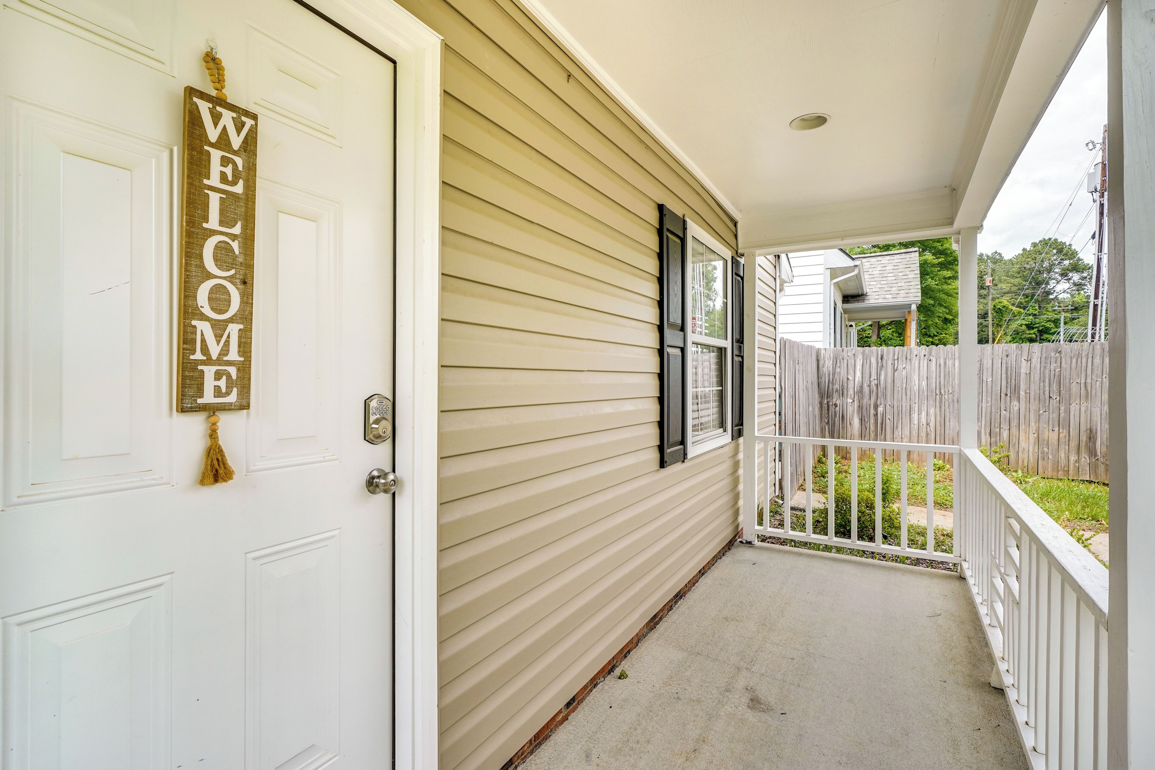 A house with a white door and a porch. - 2 Mi to Dtwn Durham: Home Near Universities (Durham)