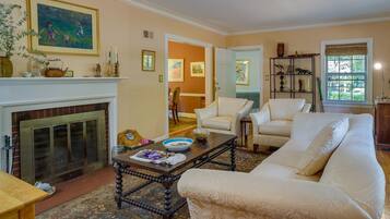 Apartment (1 Bedroom) | Living area | TV, fireplace, books