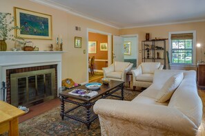 Apartment (1 Bedroom) | Living area | TV, fireplace, books - Spacious Durham Apartment Near Downtown (Durham)