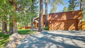 A log cabin with a garage, surrounded by large trees and a stone pathway. - Spacious Tahoe City Retreat < 2 Mi to Lake Tahoe! (Tahoe City)