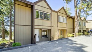 A multi-story building with a symmetrical facade, large windows, and a parking area in front. - 10 Mi to Palisades Tahoe! Condo w/ Game Room (Tahoe City)