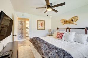A bedroom with a bed, a ceiling fan, a TV, and a door leading to another room. - Brian Head Rental w/ Community Hot Tub & Sauna! (Brian Head)