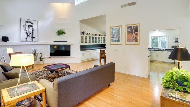 A modern living room with a sofa, TV, and artwork. - Granger Gathering Place, 4 Mi to Notre Dame (Granger)