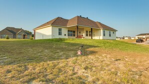 A single-story house with a front porch, a small lawn, and a clear sky. - ~ 10 Mi to Dtwn Mckinney: Home w/ Patio & Yard (McKinney)