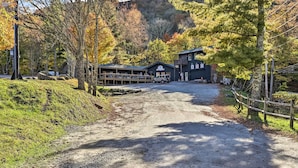 A gravel path leading to a building with a sign reading "The Lodge." - Ski, Hike & Explore! All-season Condo in Beech Mtn (Banner Elk)