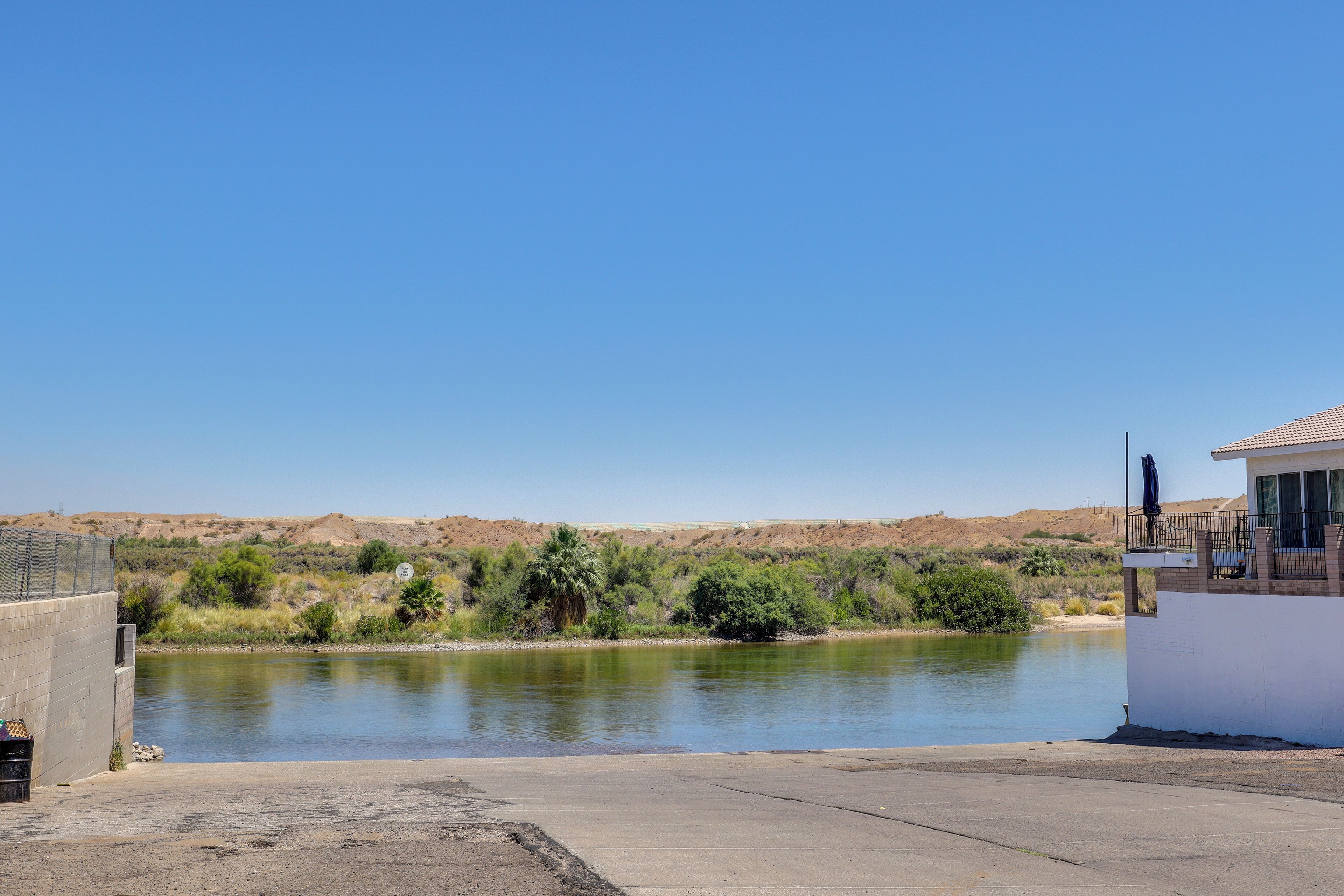 A view of a lake with a building on the right side.