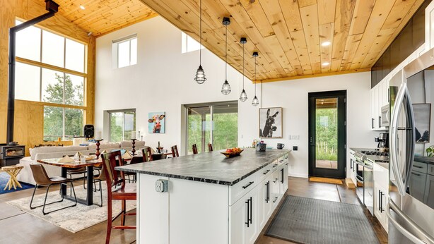 A spacious kitchen with a large island, wooden ceiling, and modern appliances. - Colorado Retreat w/ Gas Grill & Mountain Views! (Fairplay)
