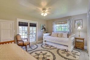 A bedroom with a bed, a chair, a window with curtains, a ceiling fan, and a lamp. - Florida Escape w/ Pool ~ 16 Mi to Fort Lauderdale! (Plantation)