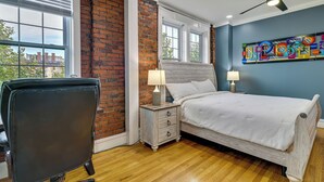 A bedroom with a bed, a chair, a nightstand, and a window. - 1 Mi to Falls View Park: Convenient Cohoes Retreat (Cohoes)