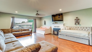 A spacious living room with a large sectional sofa, a smaller sofa, and a bed. - 3 Mi to Dtwn Yakima: Play & Stay in the Pnw! (Yakima)