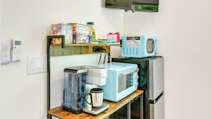 A kitchenette with a coffee maker, microwave, and toaster. There are cereal boxes and a coffee container on the counter. - 3 Mi to Dtwn Winston-salem: Studio on Miller Park! (Winston-Salem)