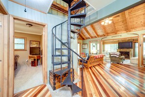 TV, fireplace, books - Tranquil Creekside Candler Vacation Rental w/ Deck (Candler)