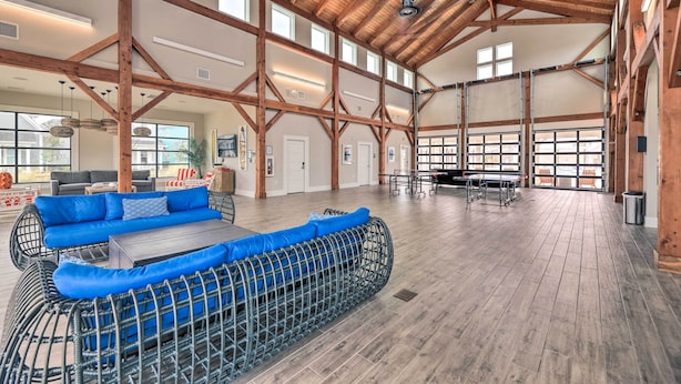A spacious indoor area with high ceilings, wooden beams, and large windows. - Beaufort Getaway w/ Pool Access, 2 Mi to Downtown! (Beaufort)