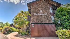 A building with a stone facade and a wooden entrance gate labeled 'B'. - Kaunakakai Vacation Rental w/ Pool Access & A/c! (Kaunakakai)