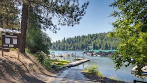 A lakeside view with a dock, boats, and a small building labeled 'Rockford Bay'. - Lakefront Bliss: Coeur D'alene Cabin w/ Dock! (Coeur d'Alene)