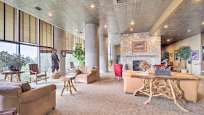 A spacious lobby with high ceilings, large windows, and a variety of seating options including sofas and chairs. - Sugar Top Resort Condo w/ Heated Pool Access! (Banner Elk)