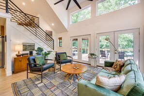 House (4 Bedrooms) | Living area | TV, books - Pet-friendly Garfield Cabin on Beaver Lake! (Garfield)