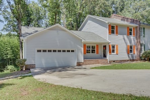 A two-story house with a white garage and orange shutters, surrounded by greenery. - Clemson Weekends 3 Mi From Memorial Stadium (Seneca)