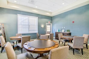 A conference room with a large oval table, several chairs, a small cabinet, and a window with blinds. - 3 Mi to Bethany Beach: Ocean View Home w/ Patio (Ocean View)