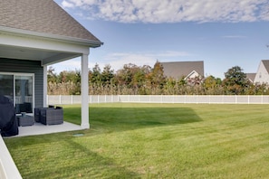 A covered patio area with outdoor furniture, a white fence, and a well-maintained lawn. - 3 Mi to Bethany Beach: Ocean View Home w/ Patio (Ocean View)