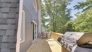 A deck with a grill and outdoor furniture. - Community Perks: Family Poconos Home w/ Deck! (Tobyhanna)