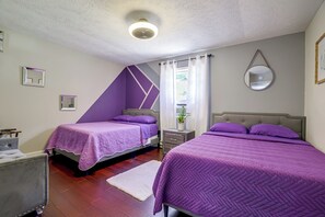 A bedroom with two beds, a nightstand, a mirror, and a window with curtains. - 'A Time to Remember' Home in Tobyhanna w/ hot tub (Tobyhanna)