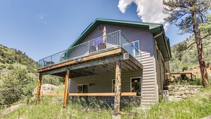 A two-story house with a balcony, surrounded by natural landscape. - Mountain Retreat in Drake w/ Fireplace & Views! (Drake)