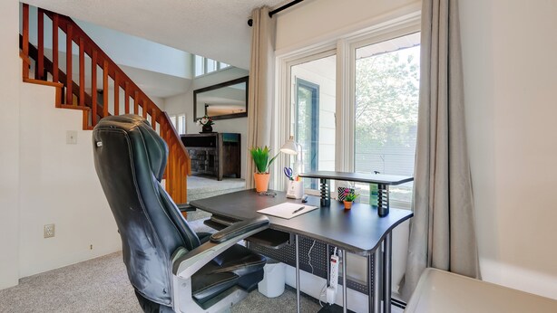 A home office with a desk, chair, and a view of the outdoors. - 3 Mi to Pioneer Park & University: Spacious Home! (Fairbanks)