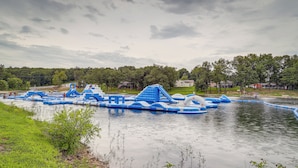An outdoor water park with inflatable slides and play structures. - Lakefront Horseshoe Bend Home w/ Boat Dock! (Horseshoe Bend)